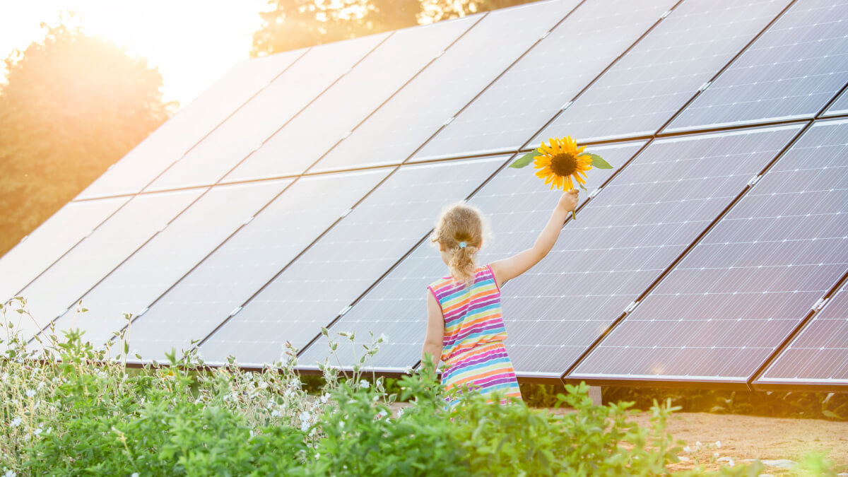 child by solar panels